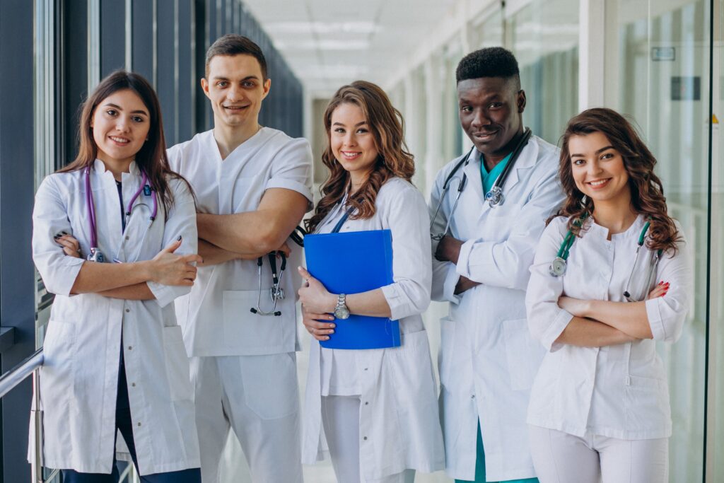 team young specialist doctors standing corridor hospital (1) min